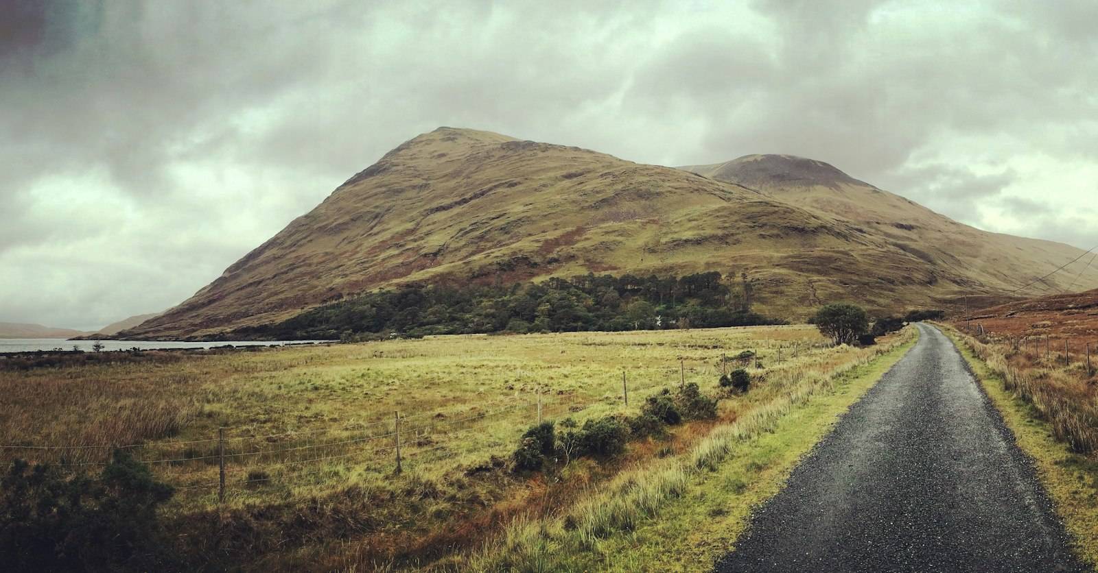 A country road in Co. Mayo with a mountain behind