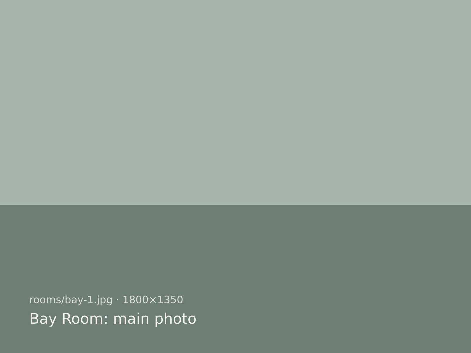 Bay Room: a large bed with white linen and a window seat facing the sea
